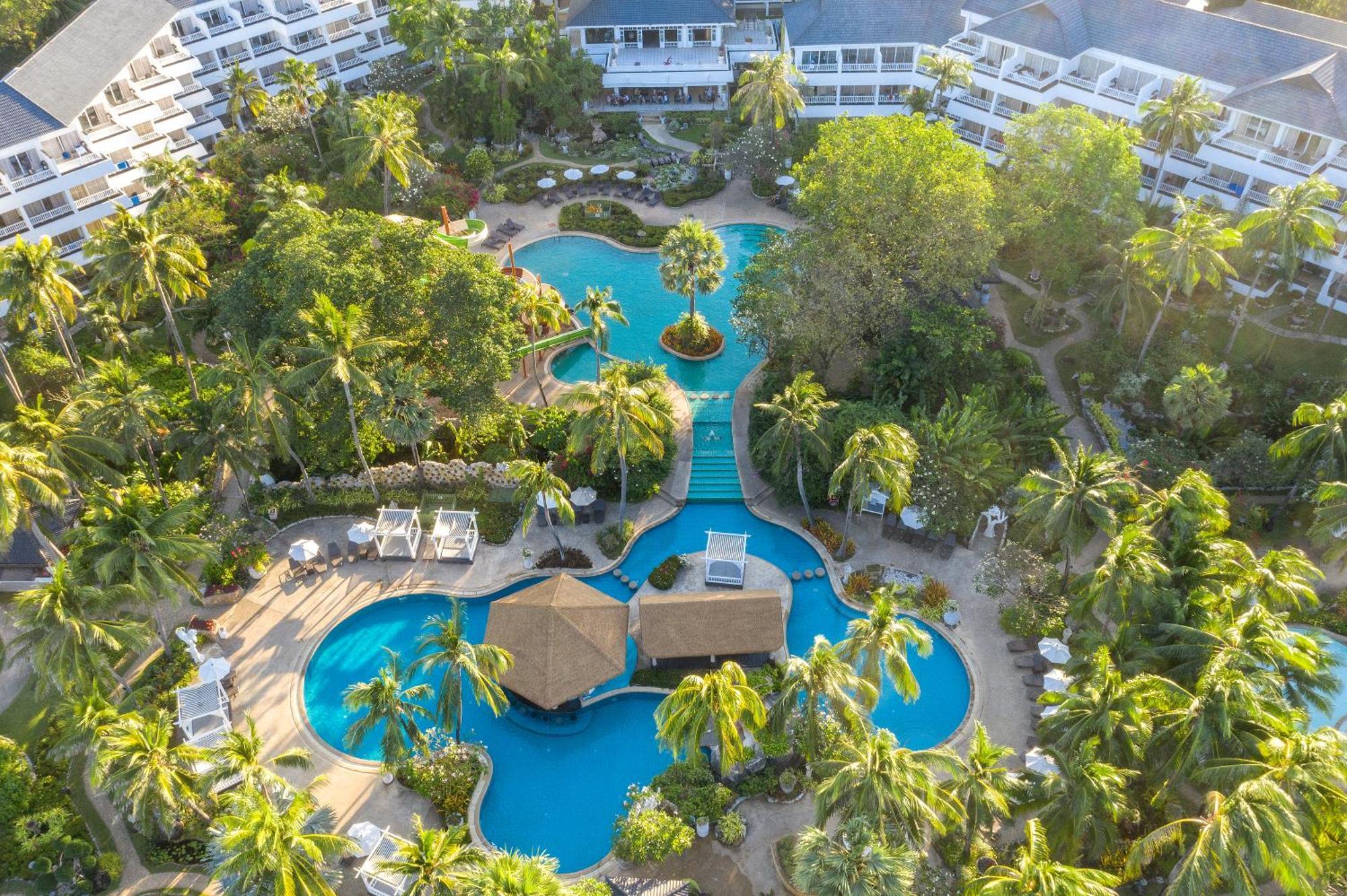 Thavorn Palm Beach Resort Phuket Karon Esterno foto Aerial view of the pool at the Royal Hawaiian Hotel